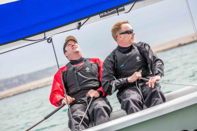 Sailor wearing the Crewsaver Atacama Sport+ drysuit on the water